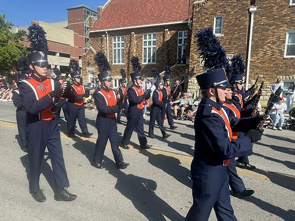 Photo of band marching for Old Settlers Day Parade